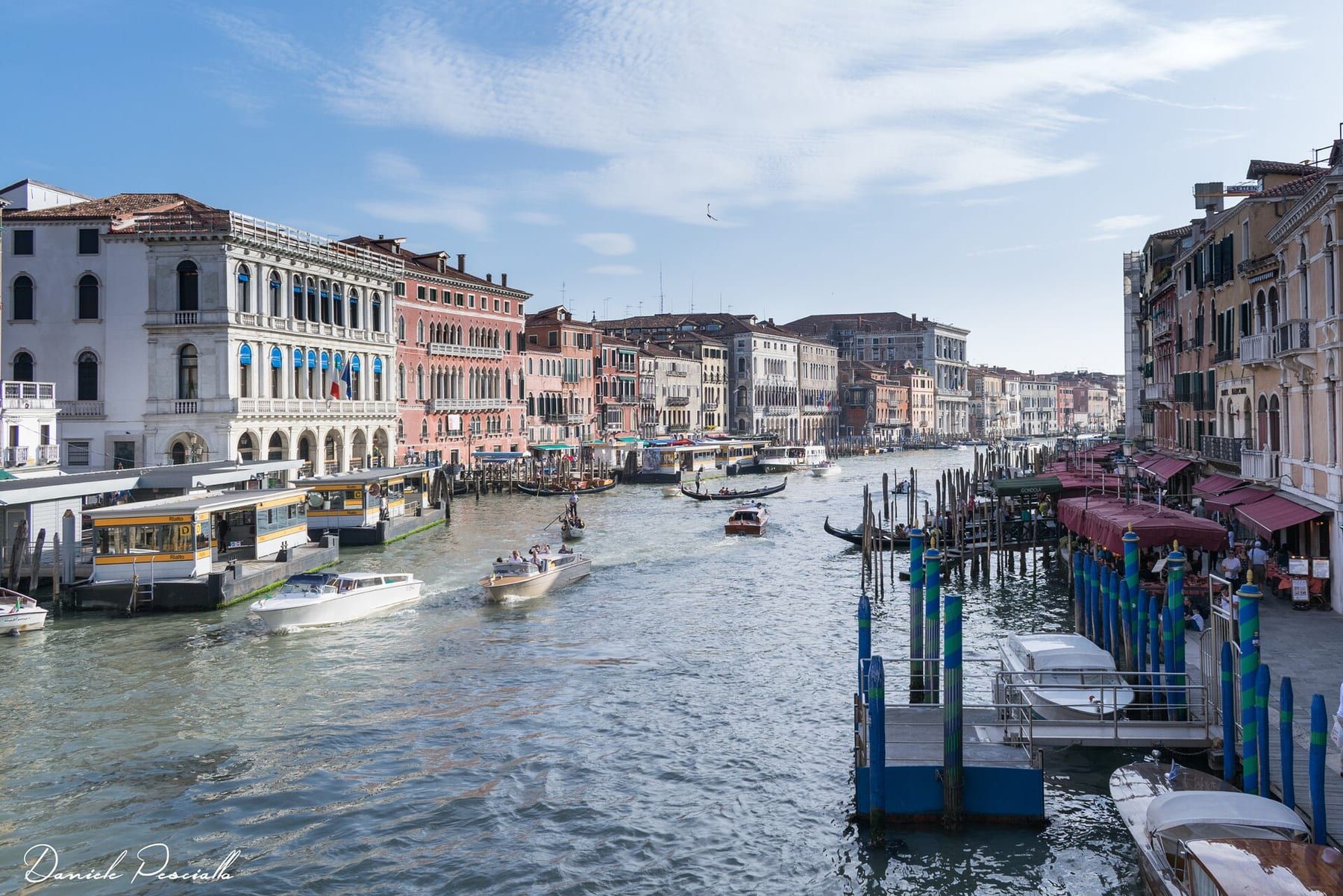 Water taxis moored in a row at a Venetian pontoon